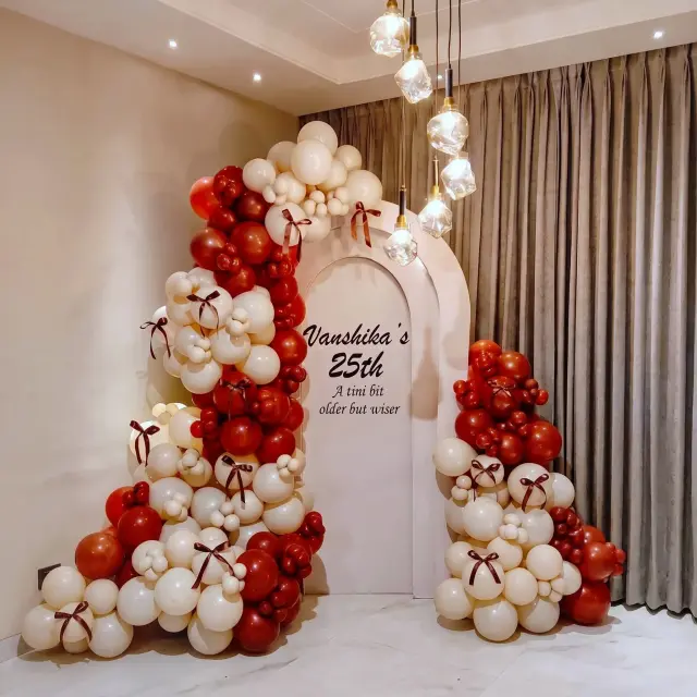 Black and gold milestone birthday balloon styling